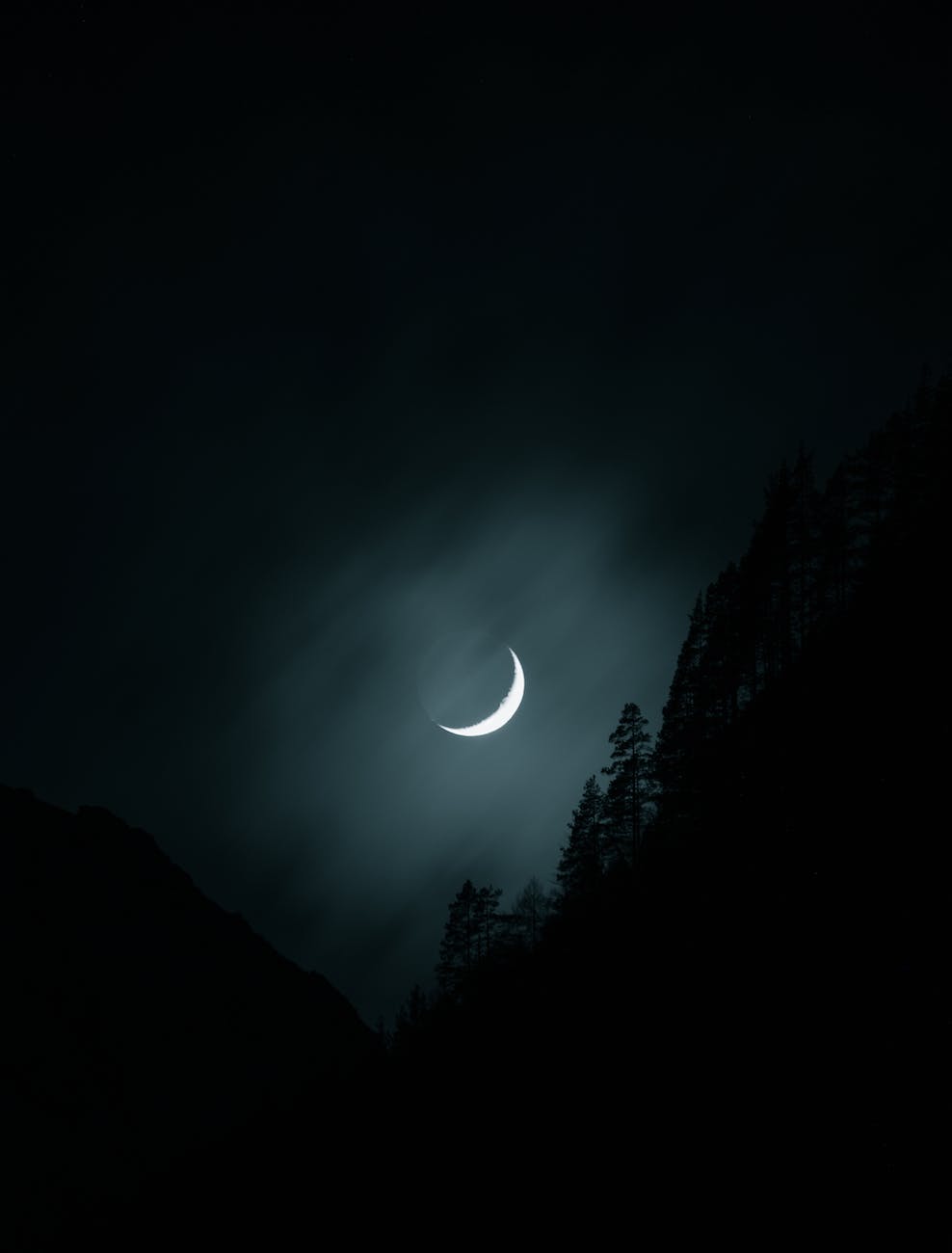 photo of moon on a dark sky